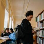 Student using best free AI tools for students in library 2026